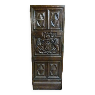 Walnut door carved with 18th century coat of arms