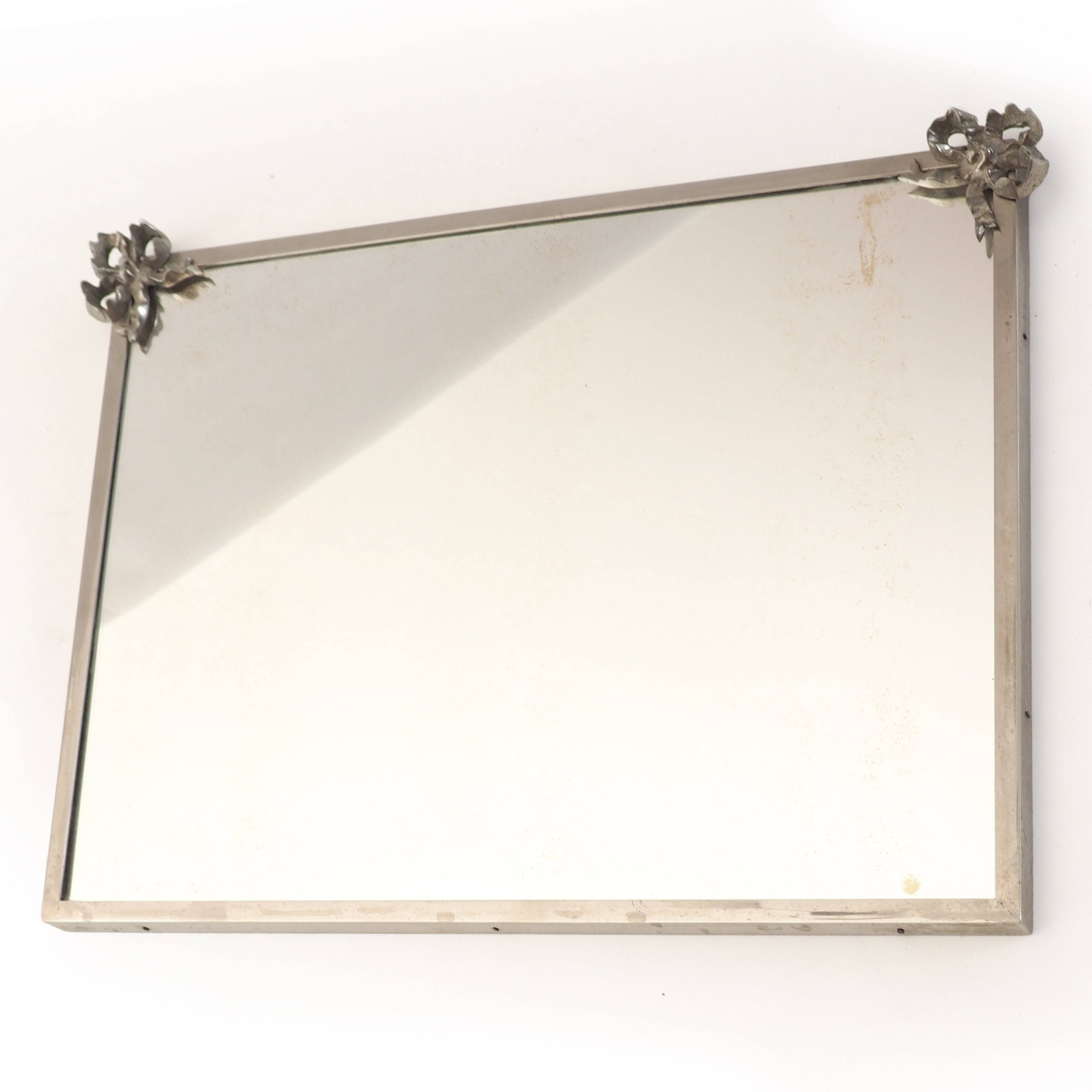 Antique mirror with silver metal rim