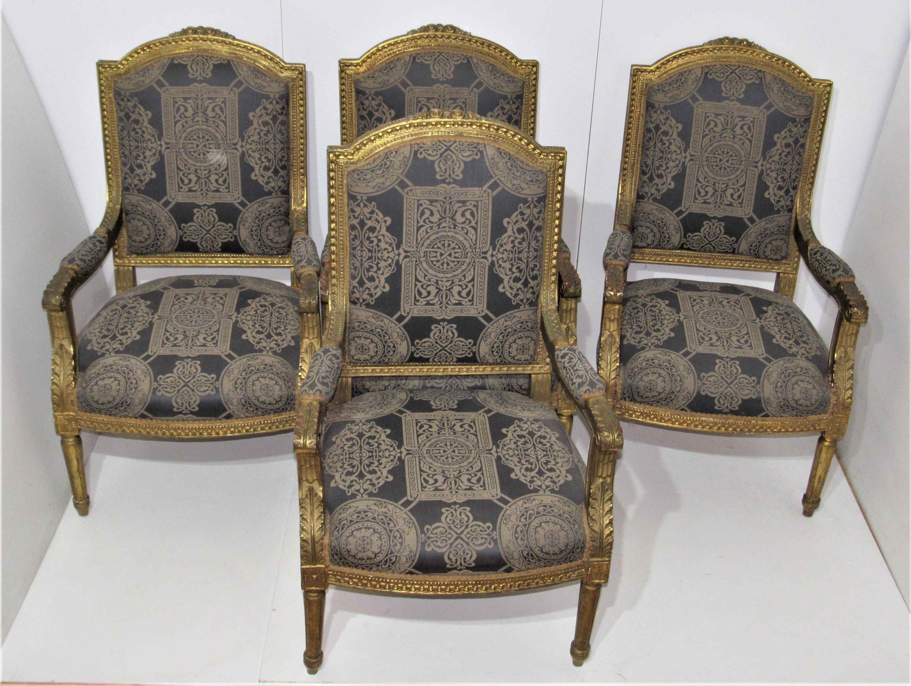 4 armchairs and a gilded wooden sofa Louis XVI style