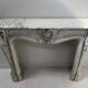 Louis XV style fireplace in veined white Carrara marble, 19th century.