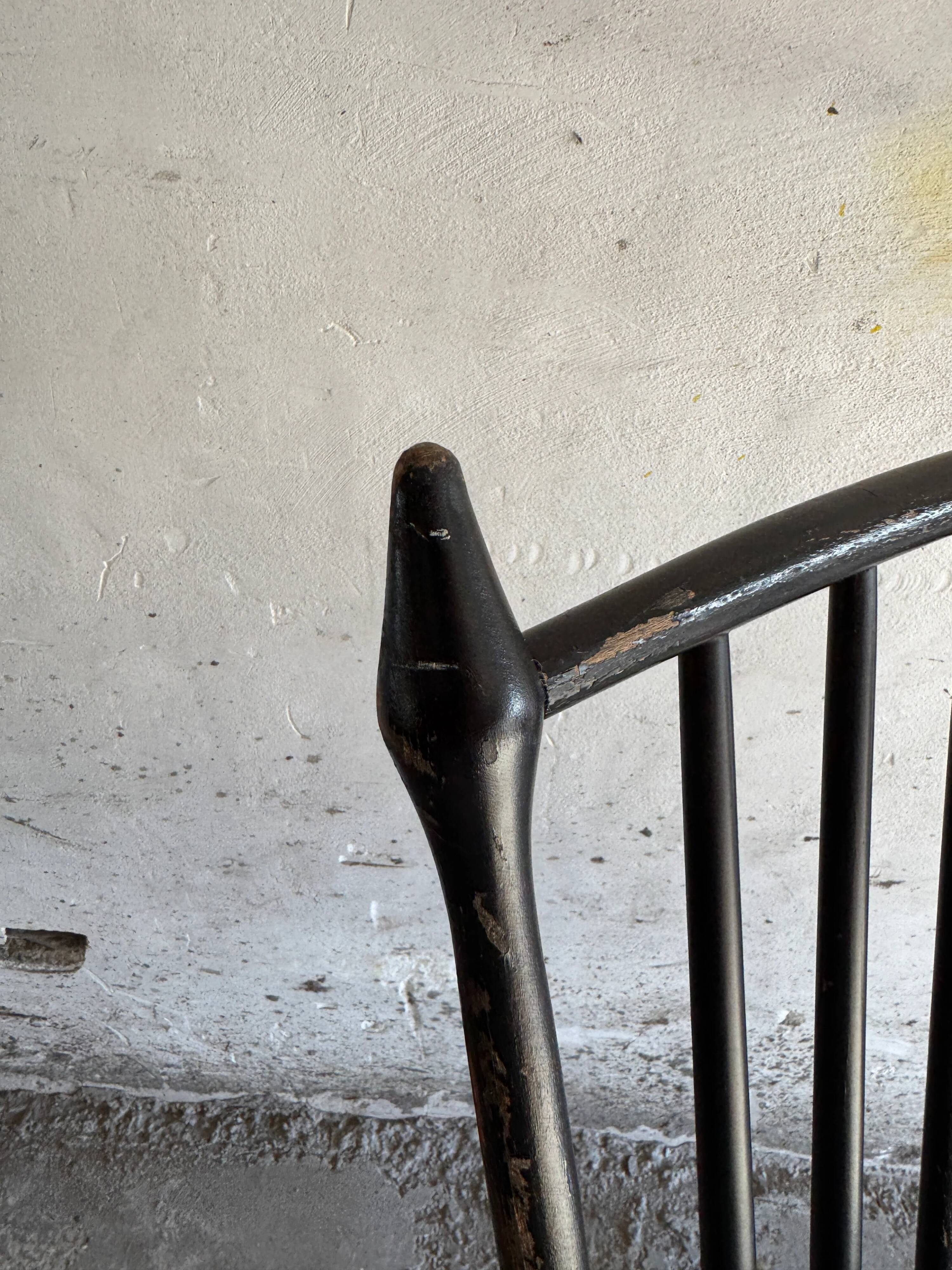 Black solid wood Scandinavian Windsor rocking chair — tall spindle back, mid-20th century