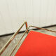 Red and brass vintage roulette service with vinyl record rack