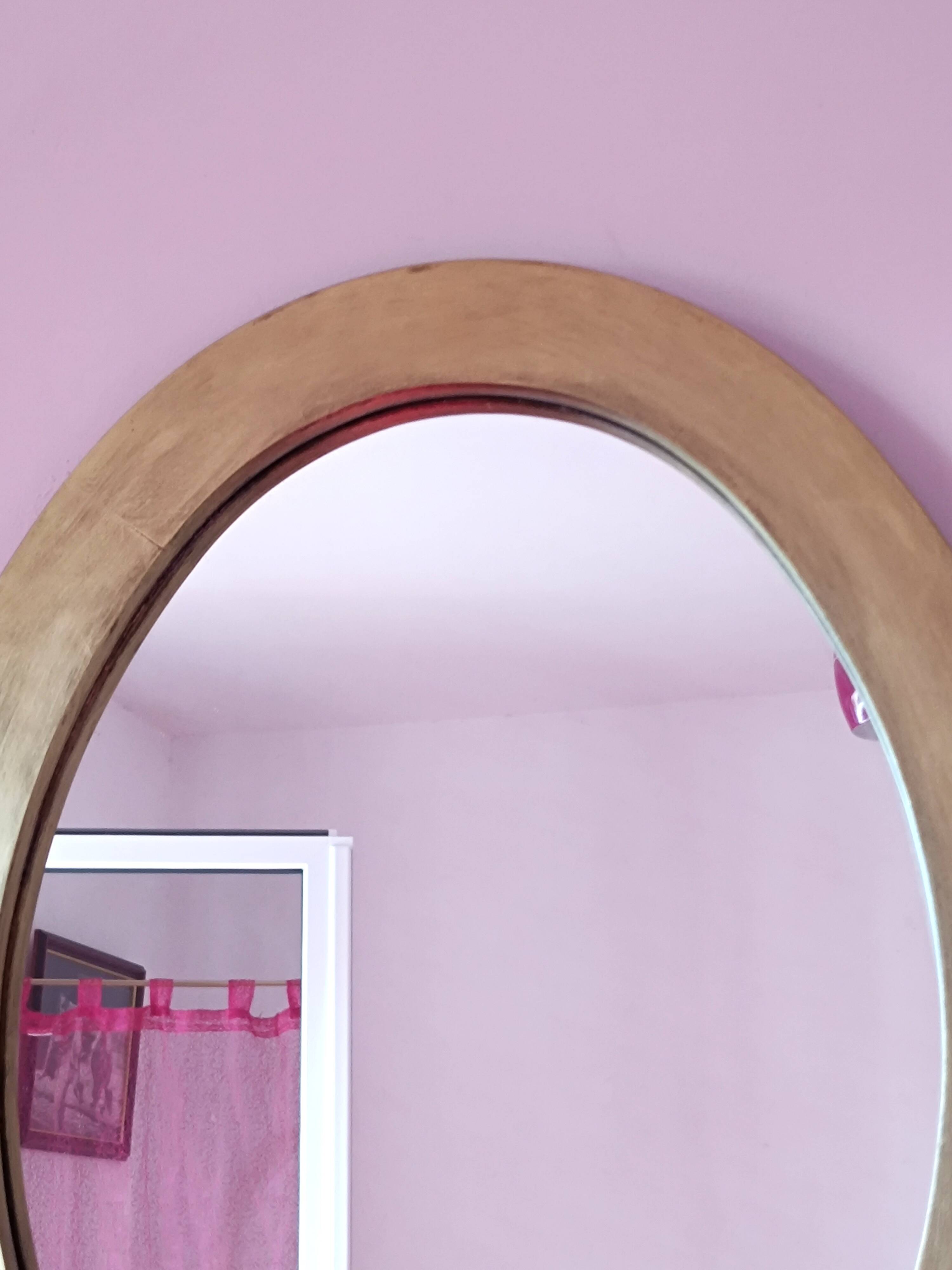 Miroir ovale en bois doré
