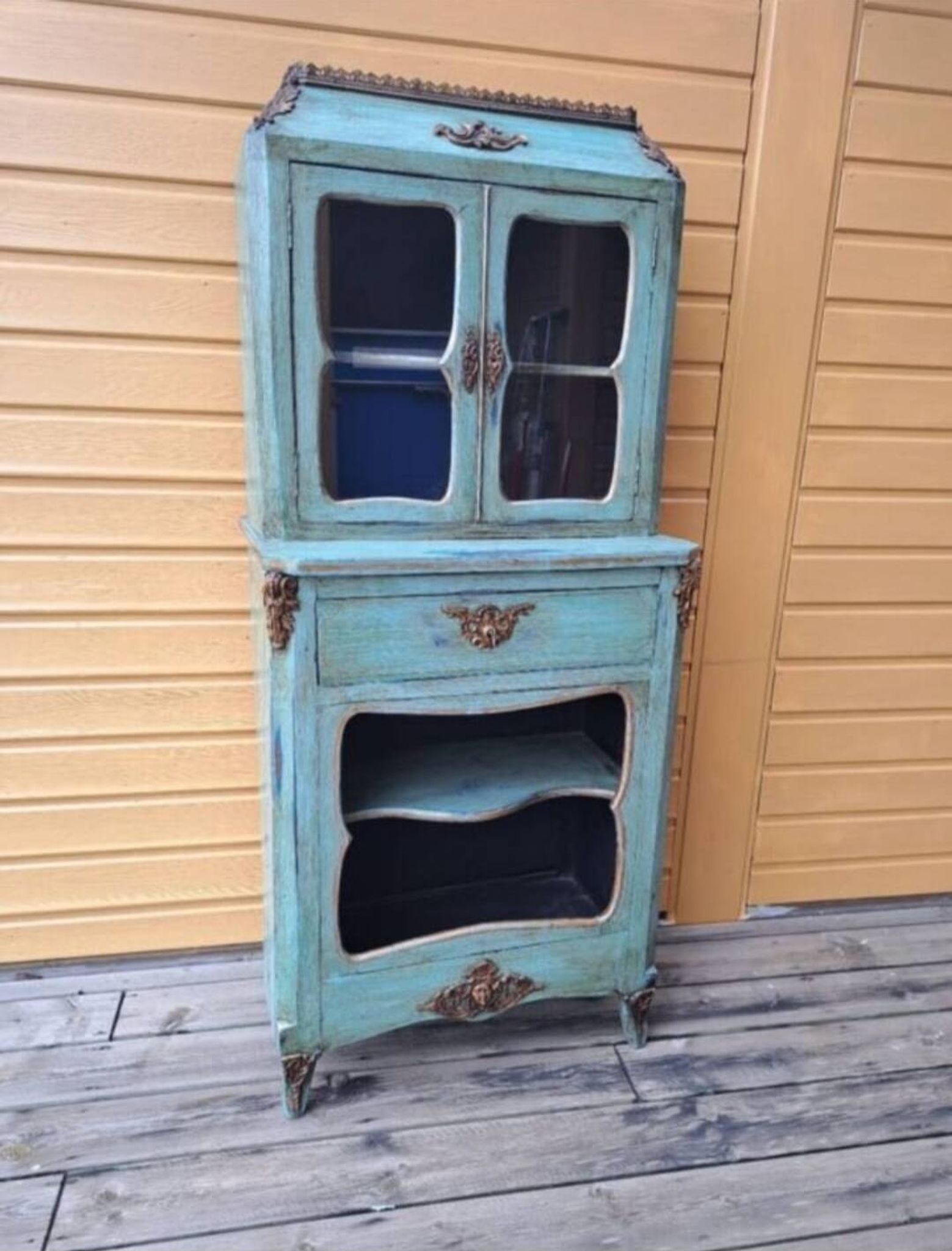Blue patinated wooden display cabinet