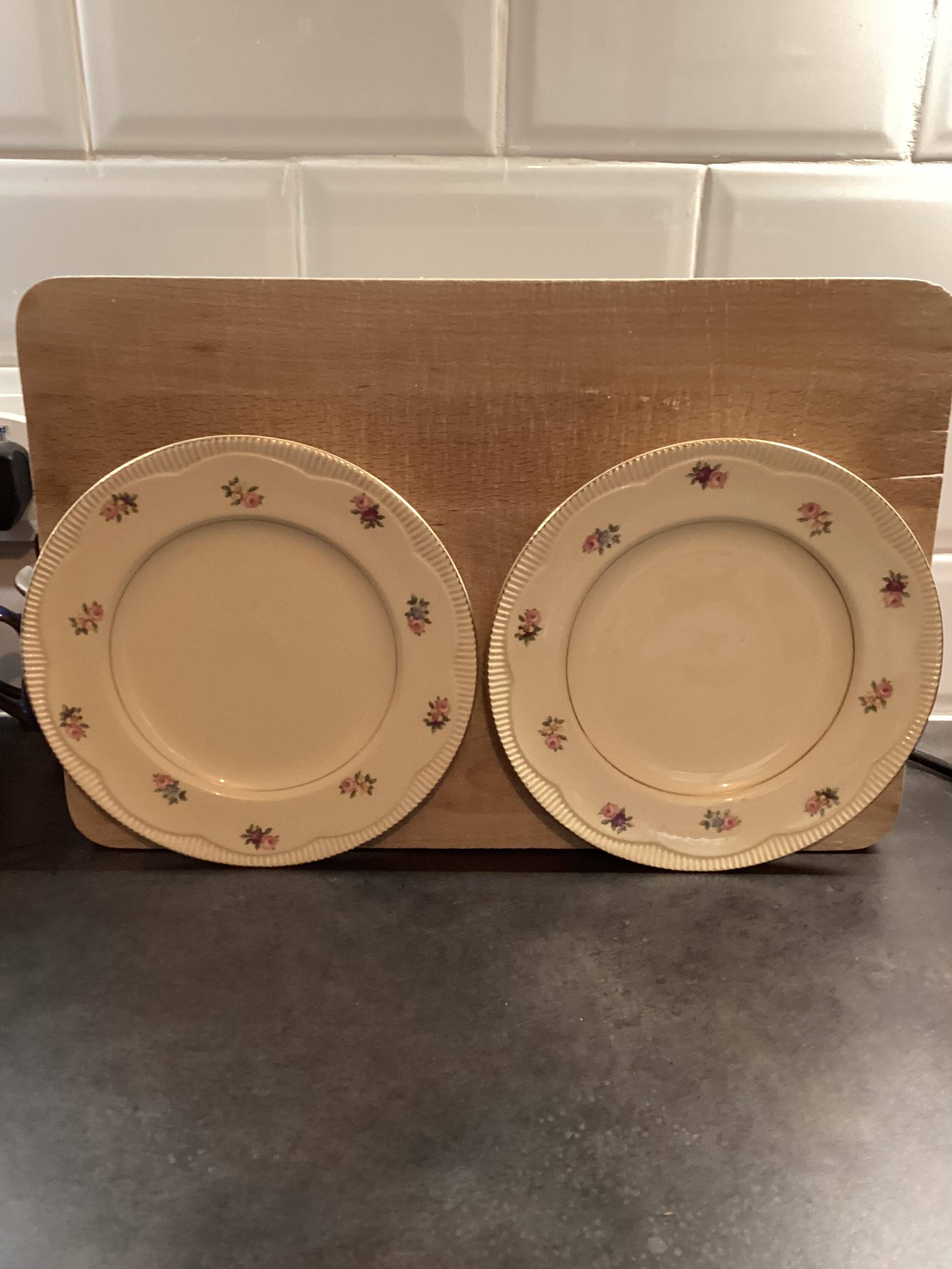 Two identical vintage Clarice Cliff plates from the Newport Pottery.