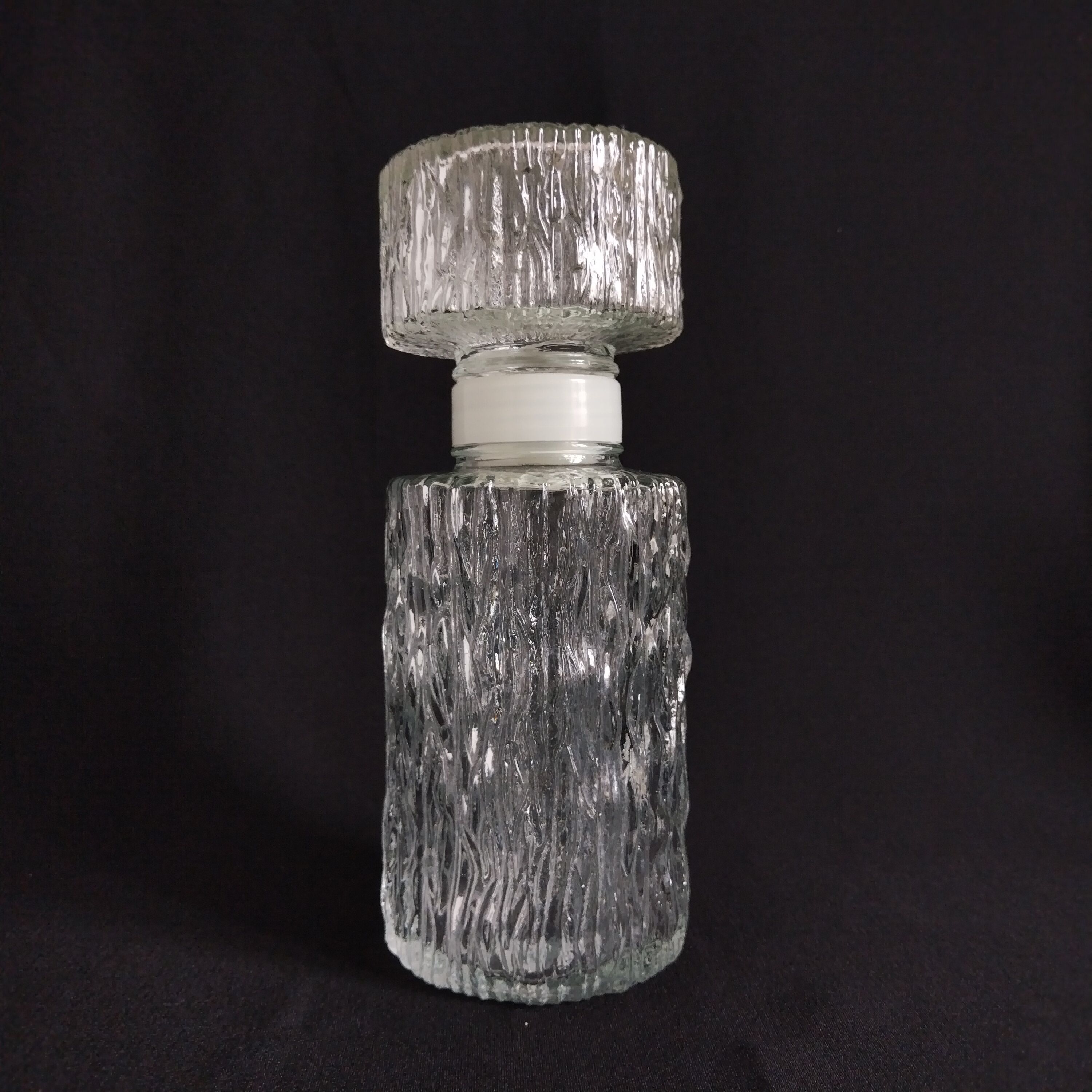 Transparent vintage carafe in pressed glass and its hermetic cap 70's