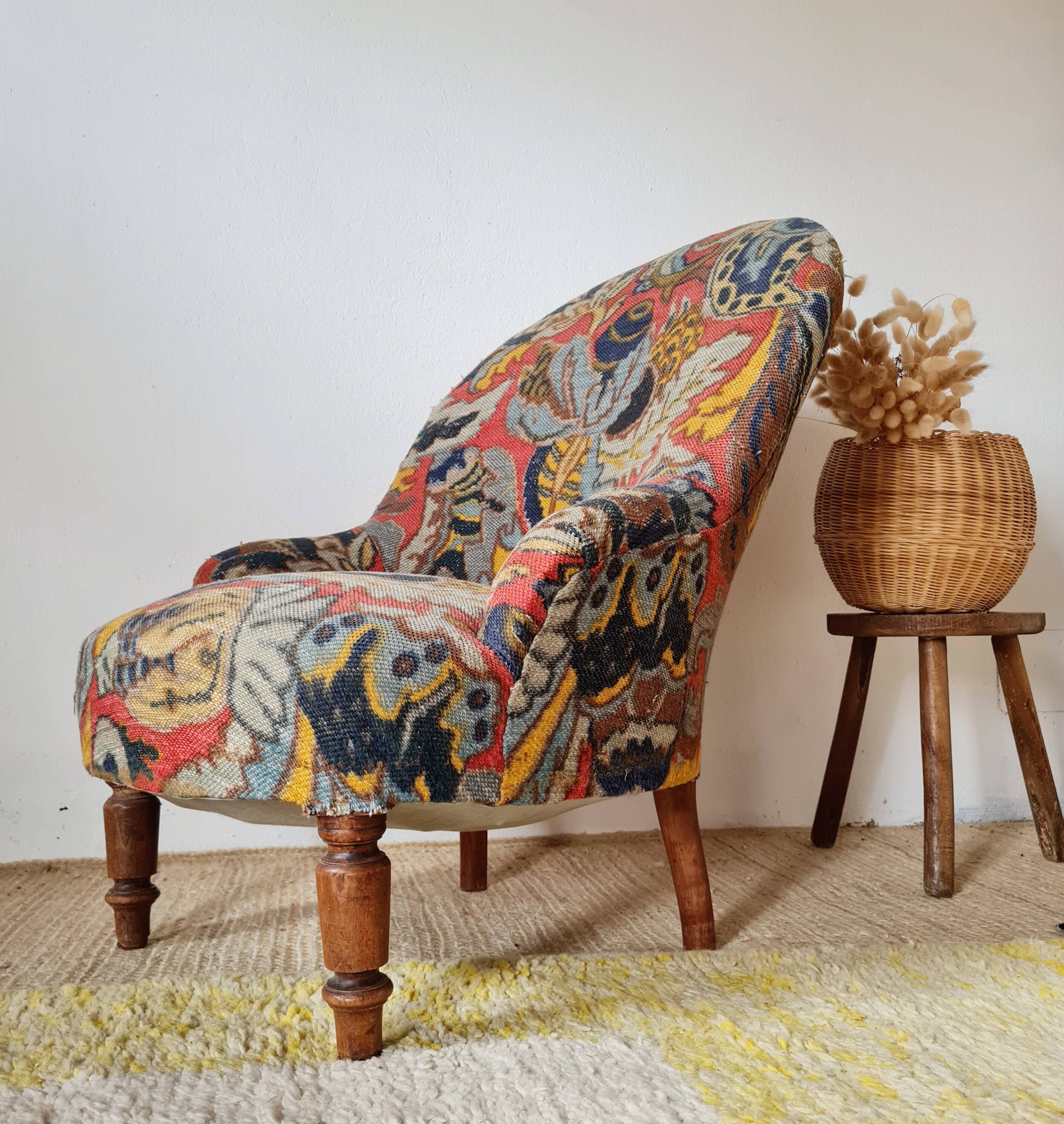 Small "madame" toad chair, vintage, upholstered in multicoloured floral fabric.