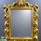 Miroir ancien style Louis XV en bois sculpté doré