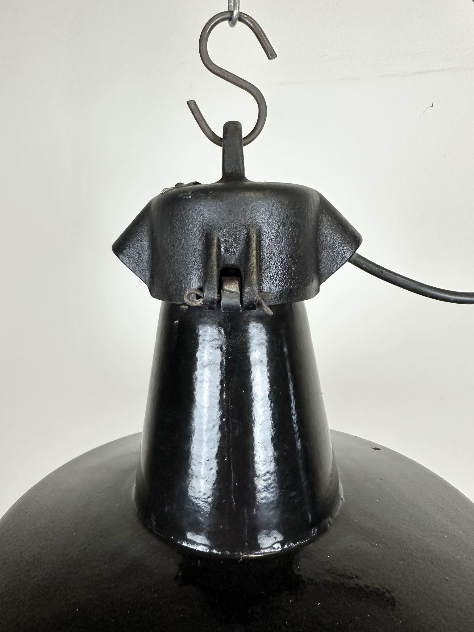 Industrial black enamel factory lamp with cast iron top, 1960s