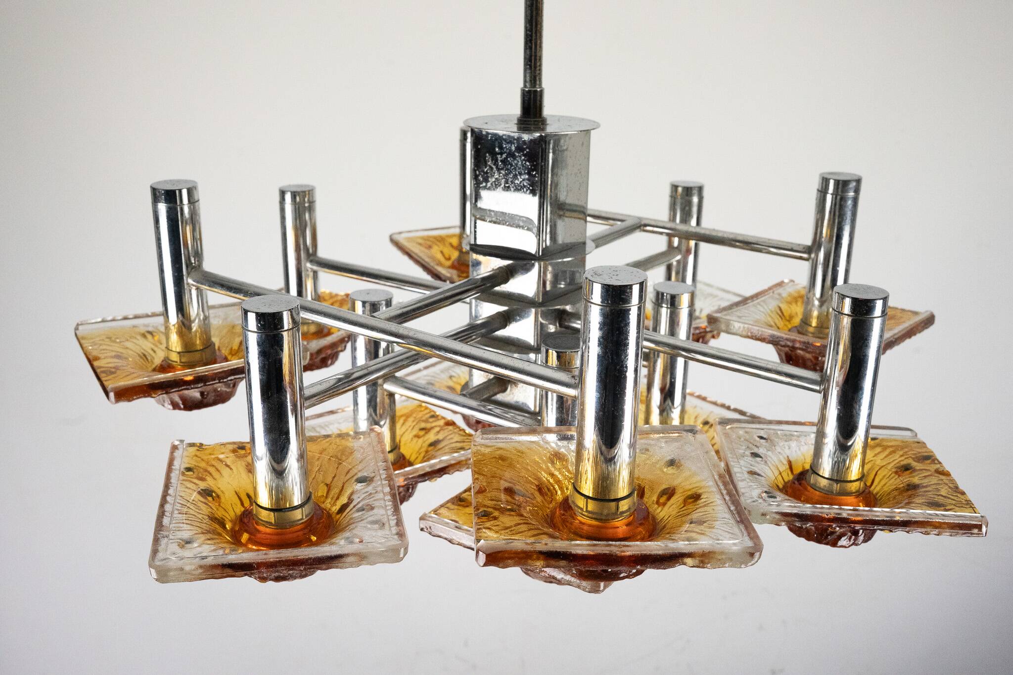 12-light Mazzega chandelier in amber and clear murano glass and chrome. Ita
