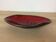 Empty black and red ceramic Elchinger pocket