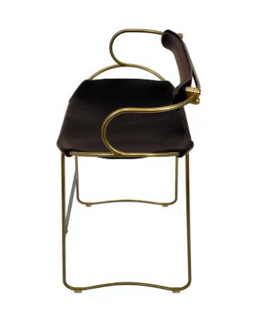 Sculptural kitchen bar stool with brass metal backrest and black leather.