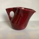 Old burgundy pitcher