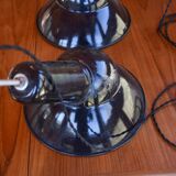 Pair of black enamelled sheet metal pendant lights from the 1950s.
