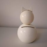 Wooden piggy bank, white cat