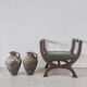 Green curule armchair