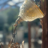 Basket chandelier with crystal and gilded brass pendants, circa 1930.