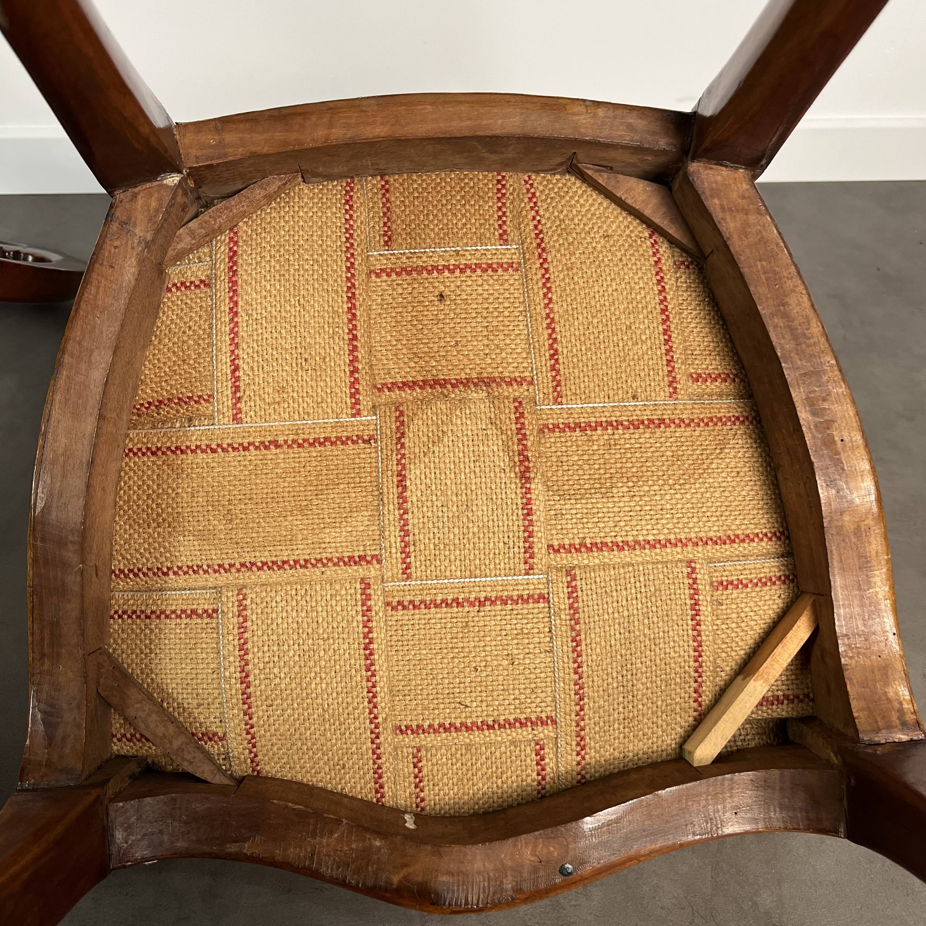 Pair of Victorian English chairs known as balloon chairs in solid mahogany.