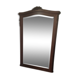 Hazed and carved wooden mirror