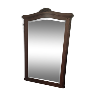 Hazed and carved wooden mirror