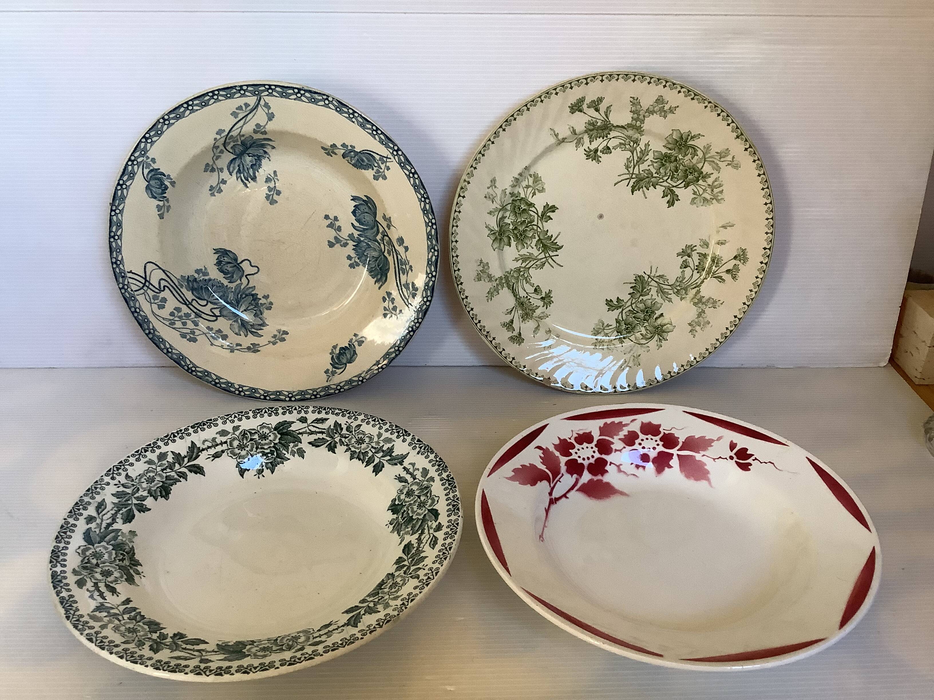Four old earthenware plates