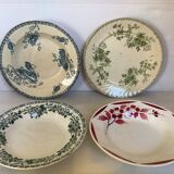 Four old earthenware plates