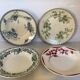 Four old earthenware plates