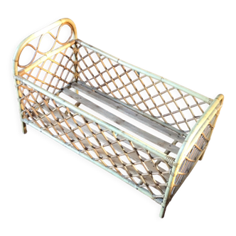 Vintage rattan doll bed