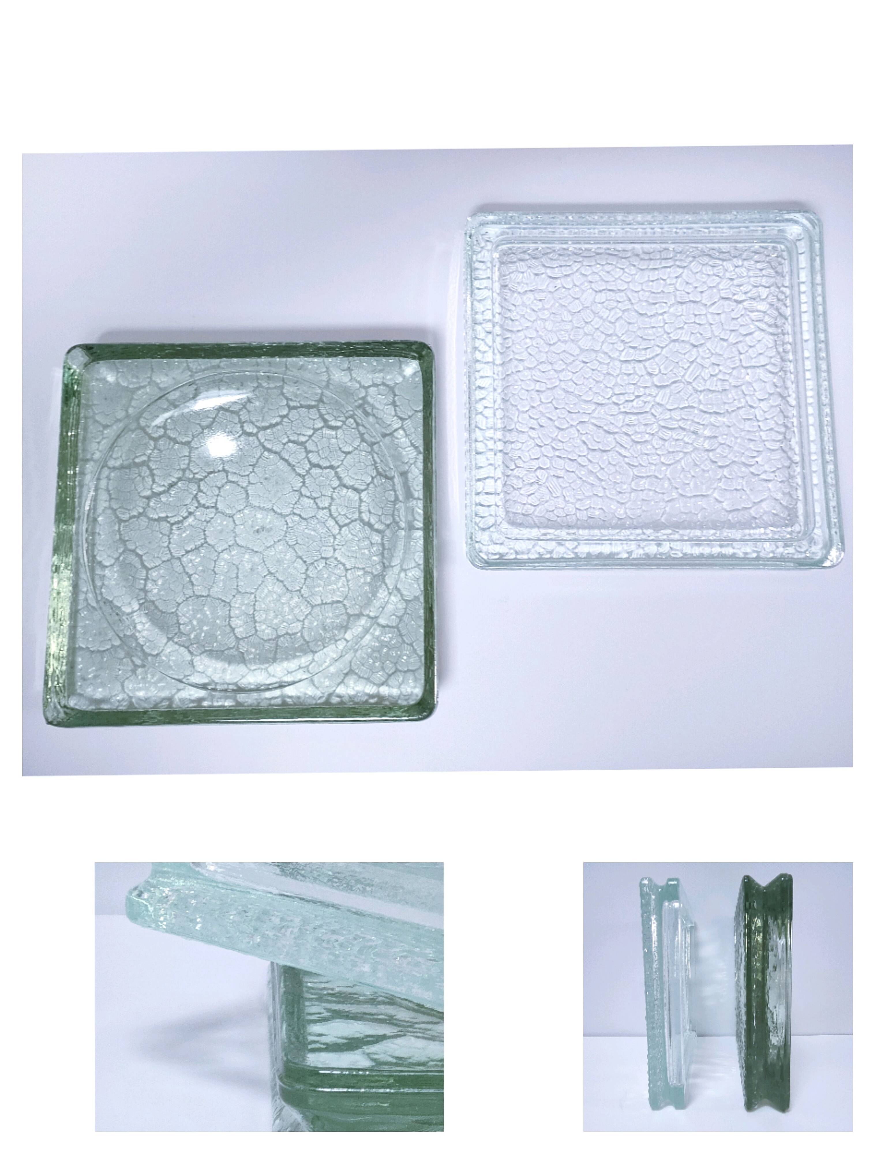 Two designer glass paving pockets