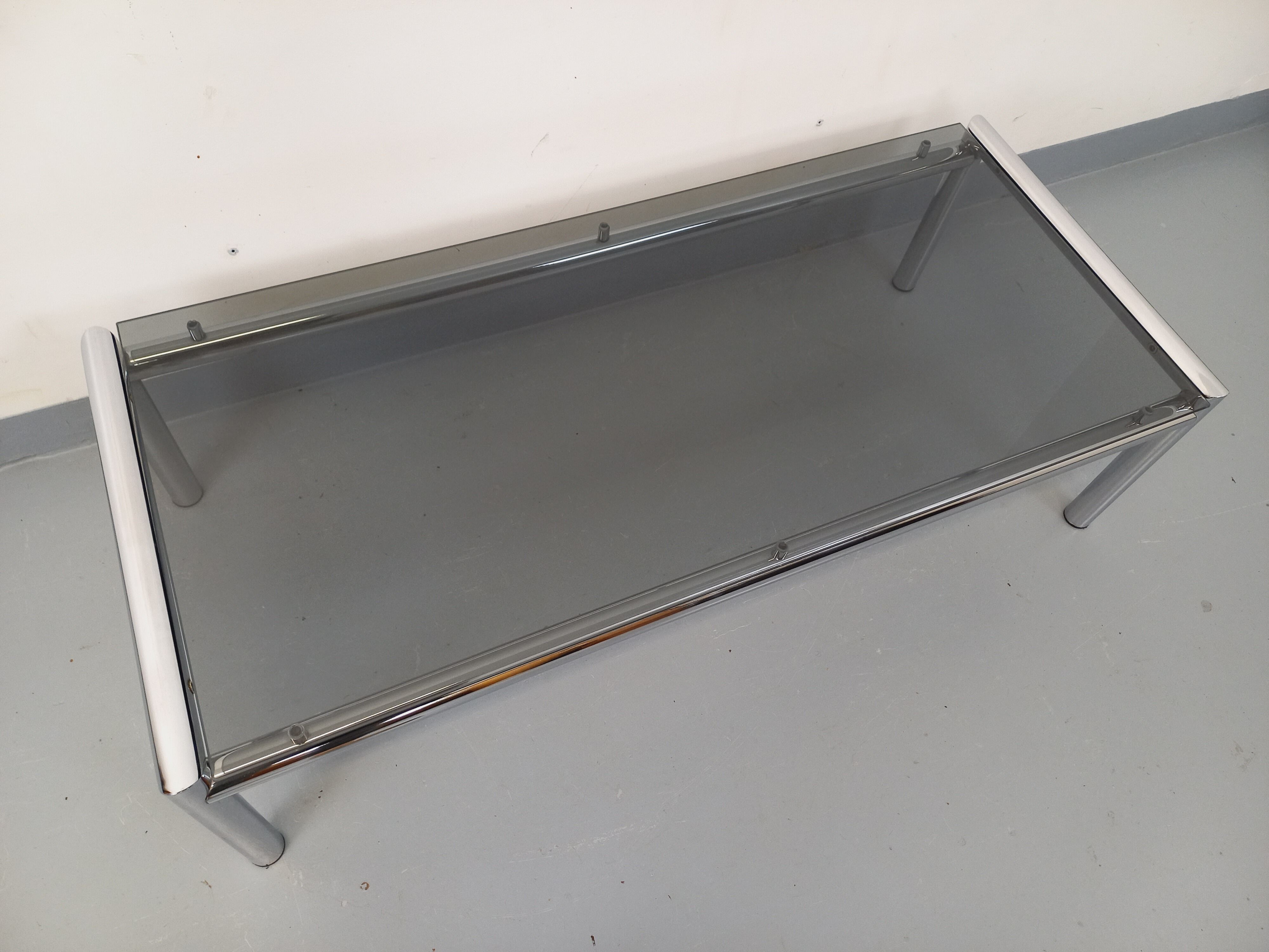 Vintage rectangular coffee table in smoked glass and chrome metal from the 1960s.