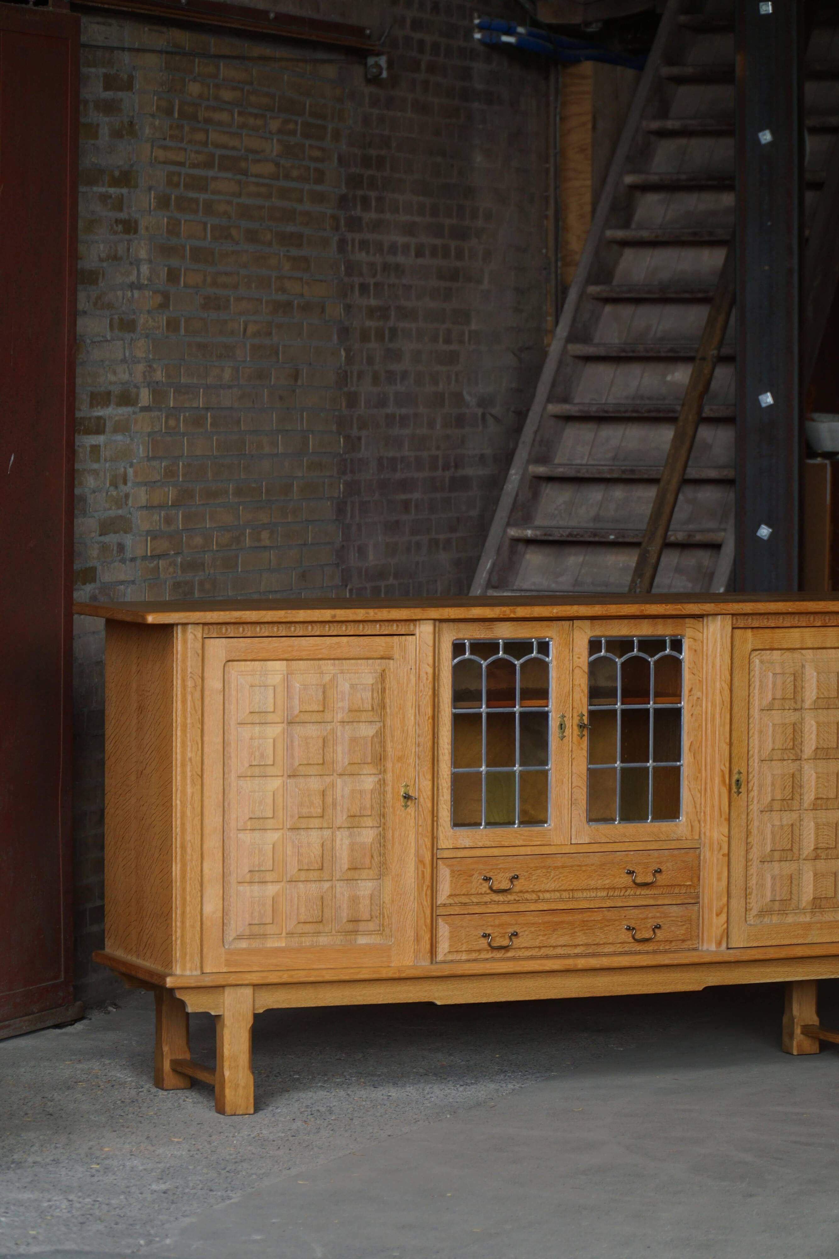 Danish oak buffet with lead glass doors, Henning Kjærnulf, Denmark, 1960s