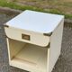White Scandinavian bedside table in boat style made of wood.