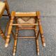 2 square stools made of carved solid wood with rush seats from the 1970s.