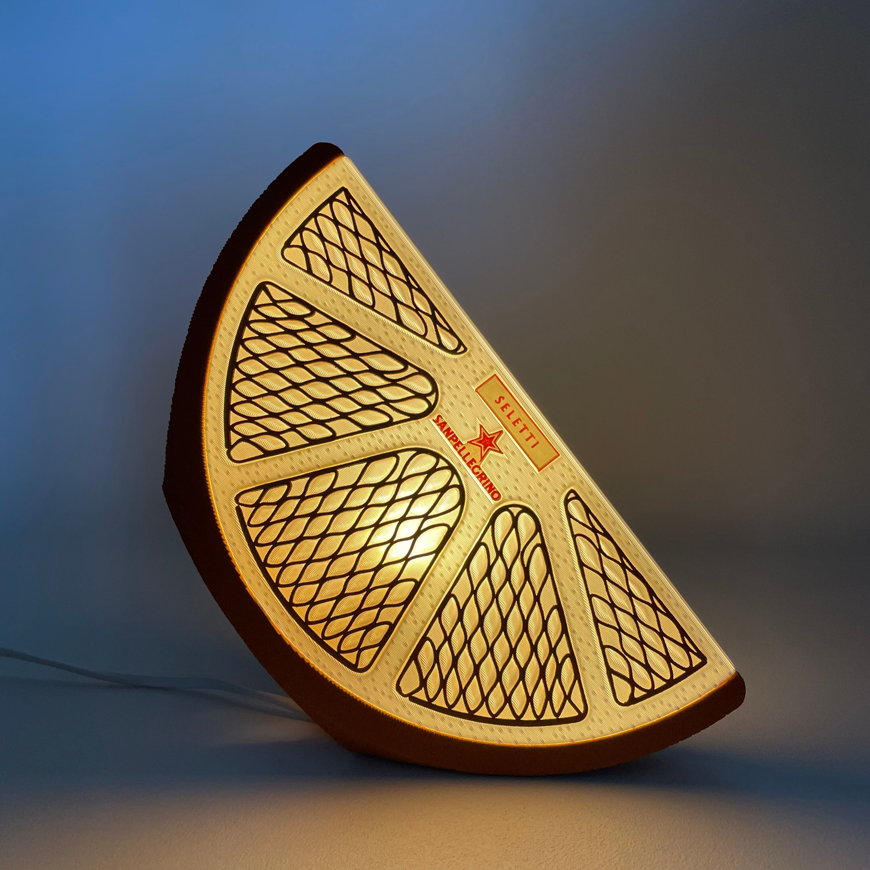 Orange quarter table lamp Seletti and Sanpellegrino