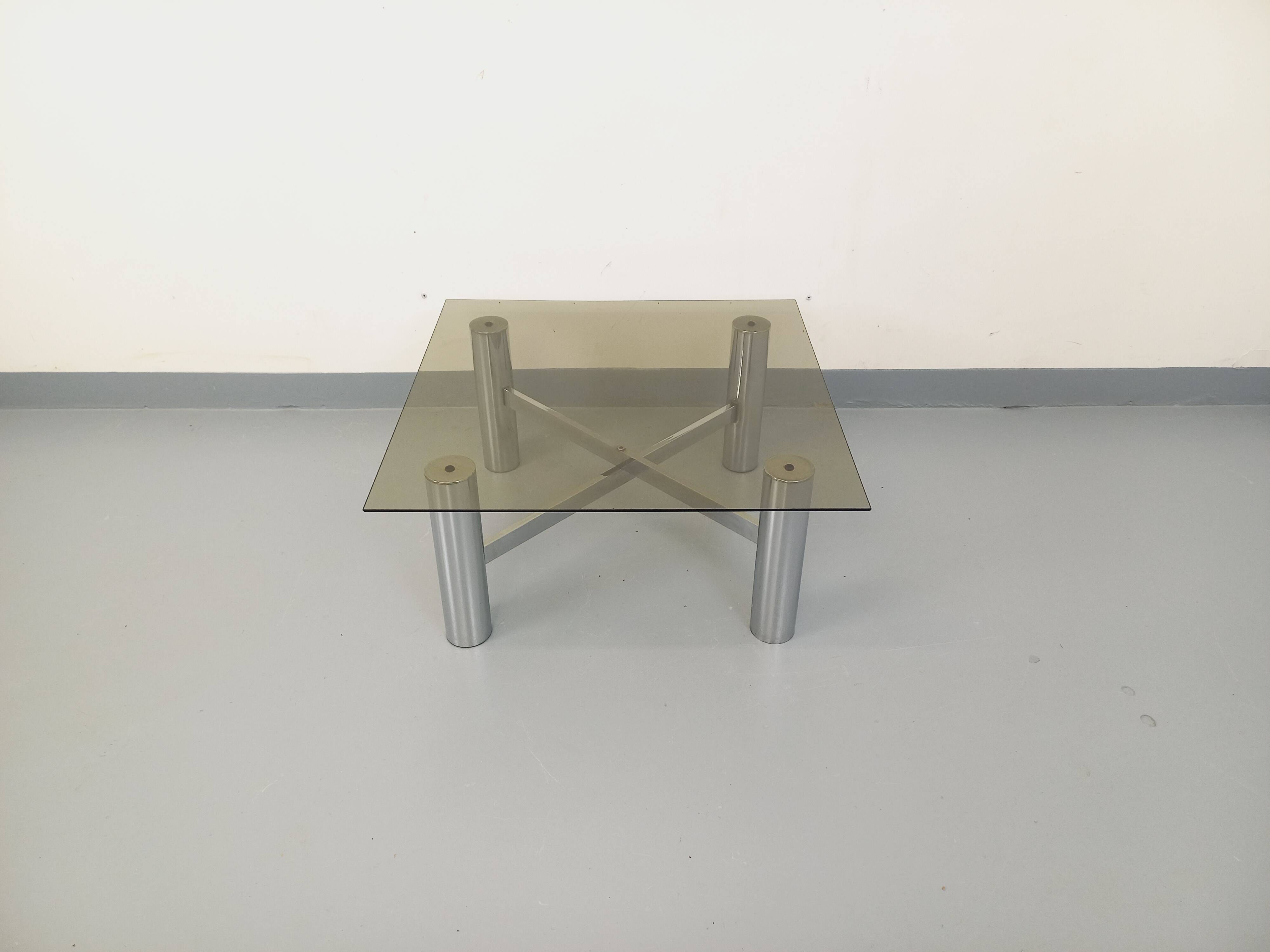 Square Italian vintage Space Age coffee table in smoked glass and metal.