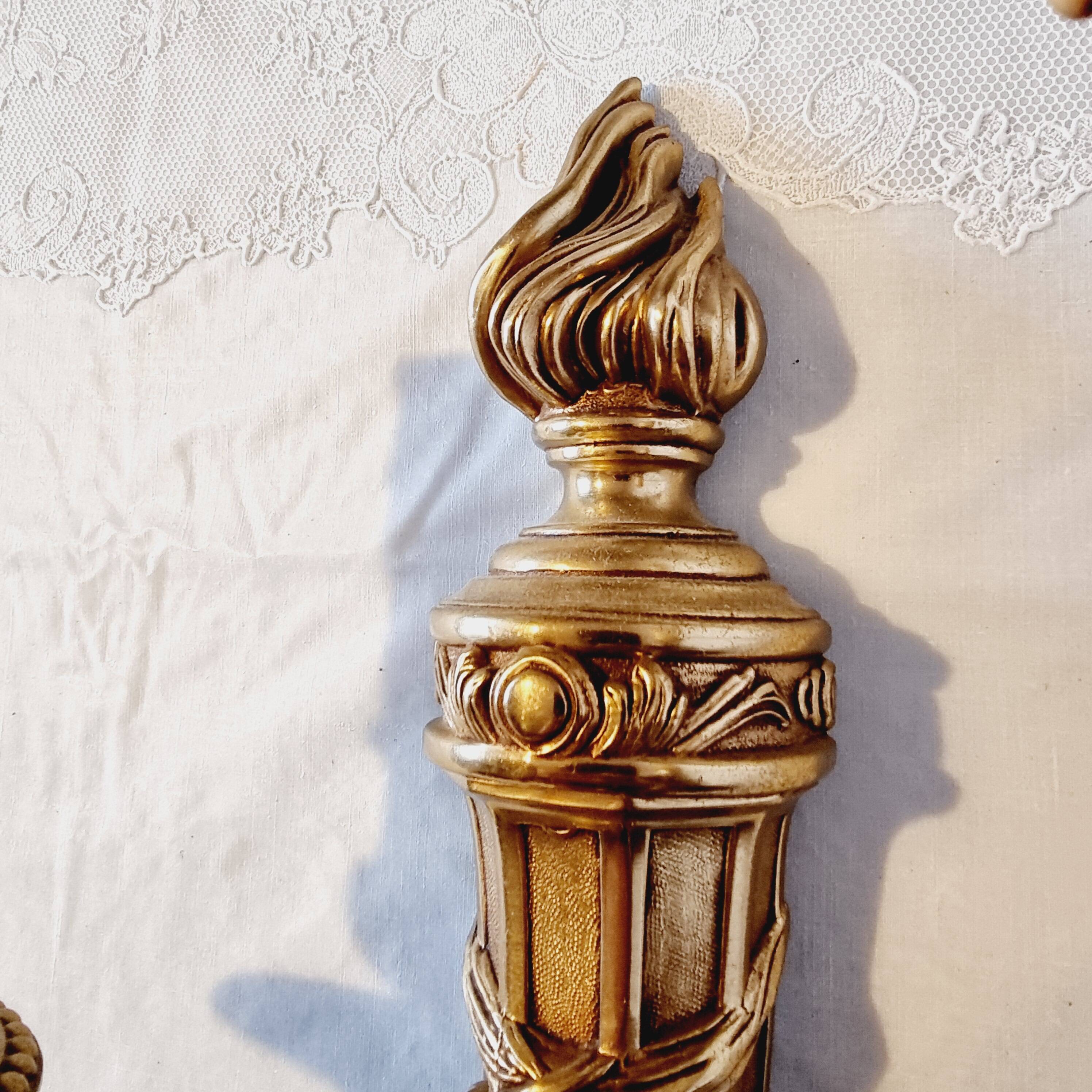 Pair of Louis XV style rocaille two-armed sconces in gilded bronze