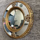 Antique domed witch's eye mirror in gilded wood