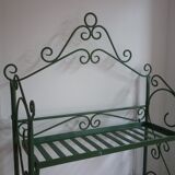 Folding green wrought iron shelf