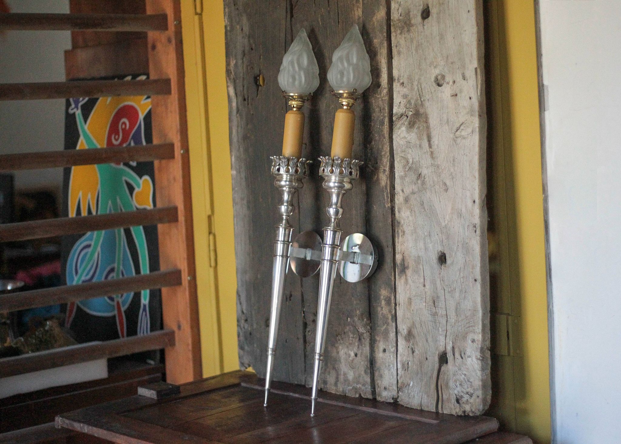 Large pair of silver-plated wall lights with flame globes, torches.