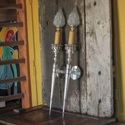 Large pair of silver-plated wall lights with flame globes, torches.