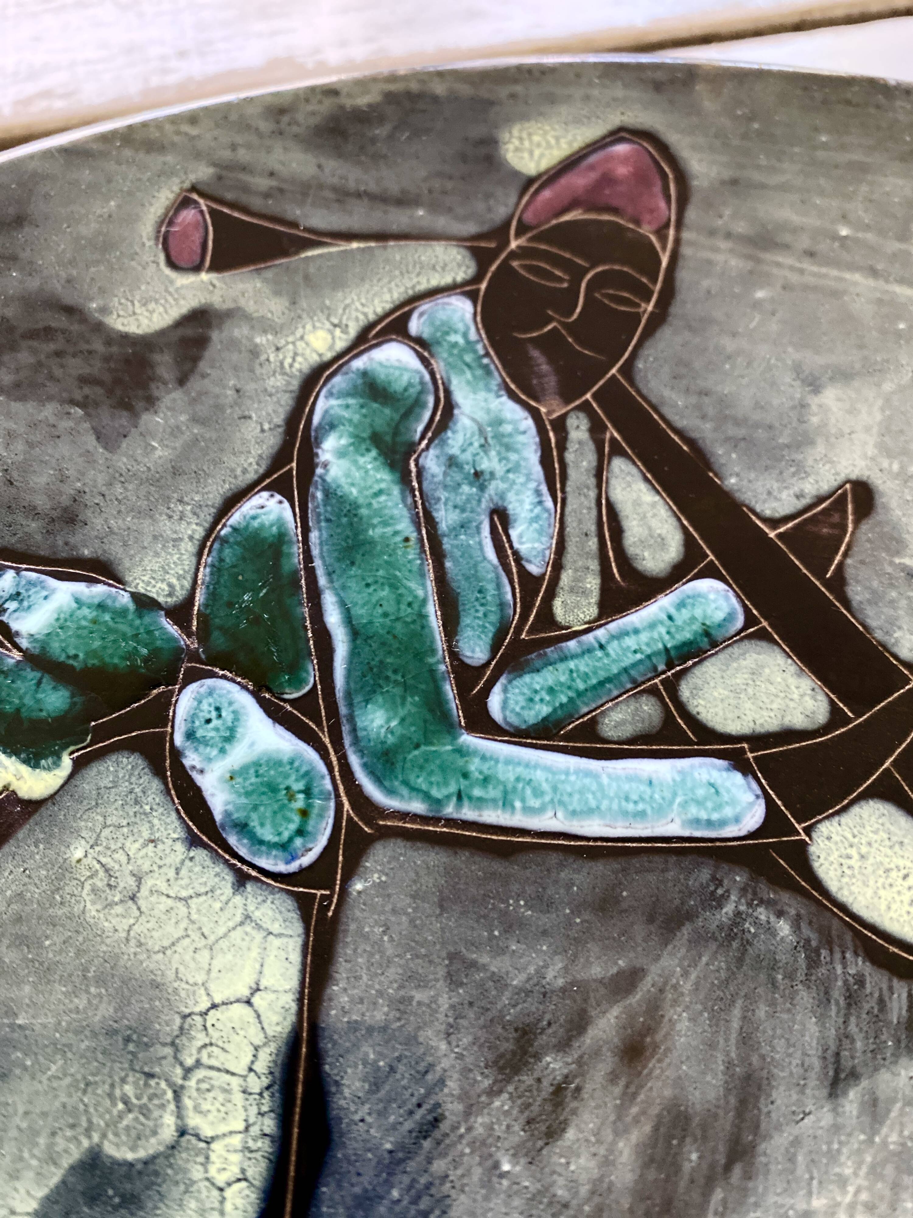 Musicians ceramic dish, signed