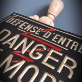 Plate embossed trespassing