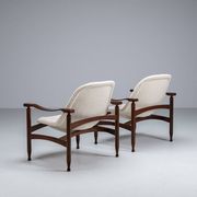 Pair of “Tiki” lounge chairs in teak and bouclé Busnelli Italy 1960