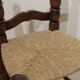 Pair of rustic chairs in turned wood with straw seats