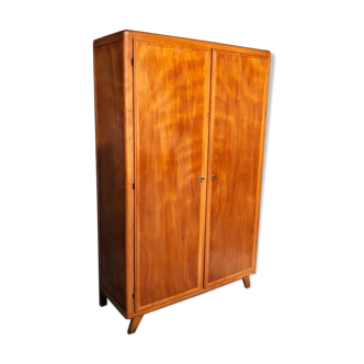 Vintage wooden cabinet with compass feet