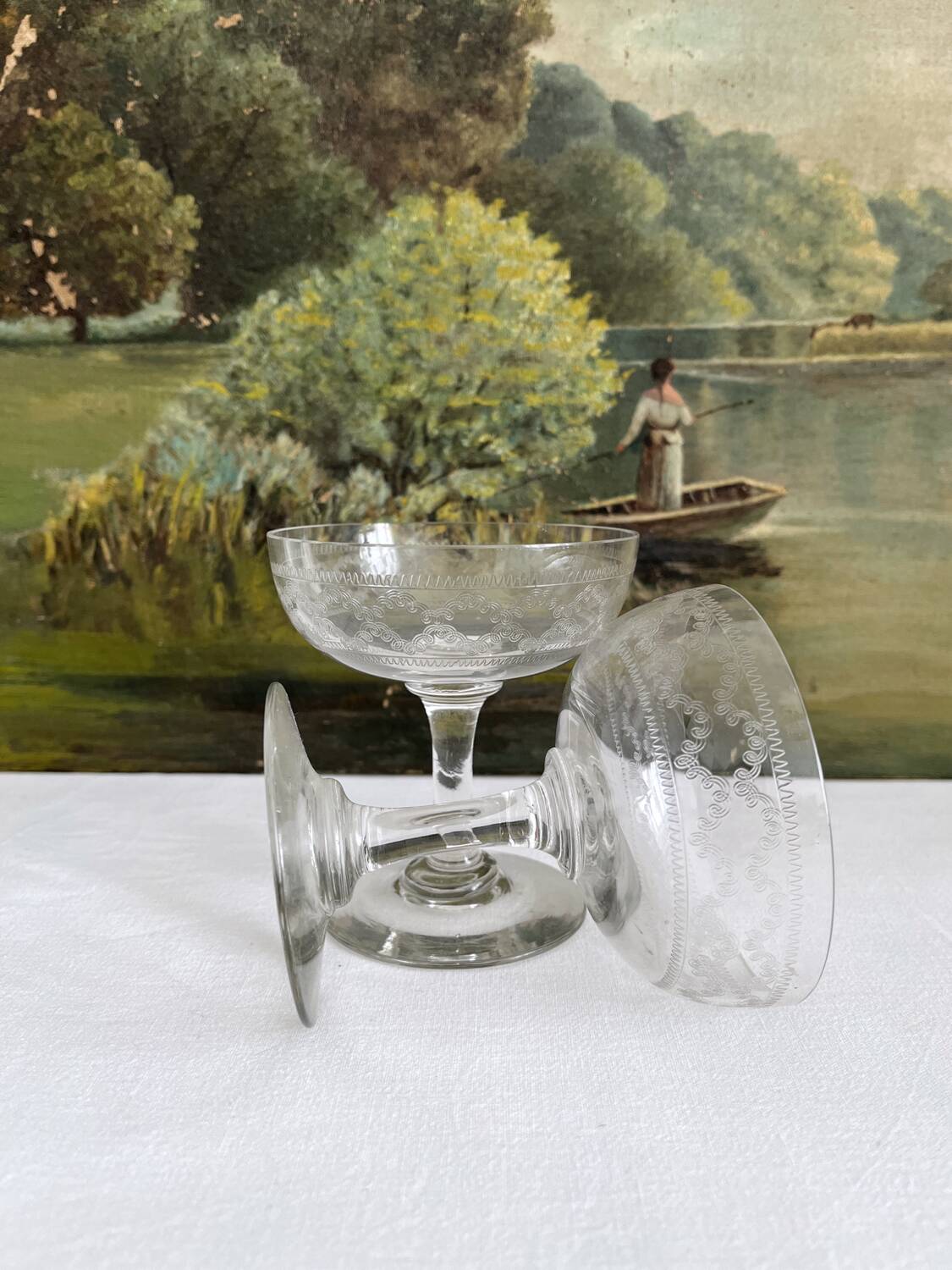 2 antique champagne glasses in engraved glass