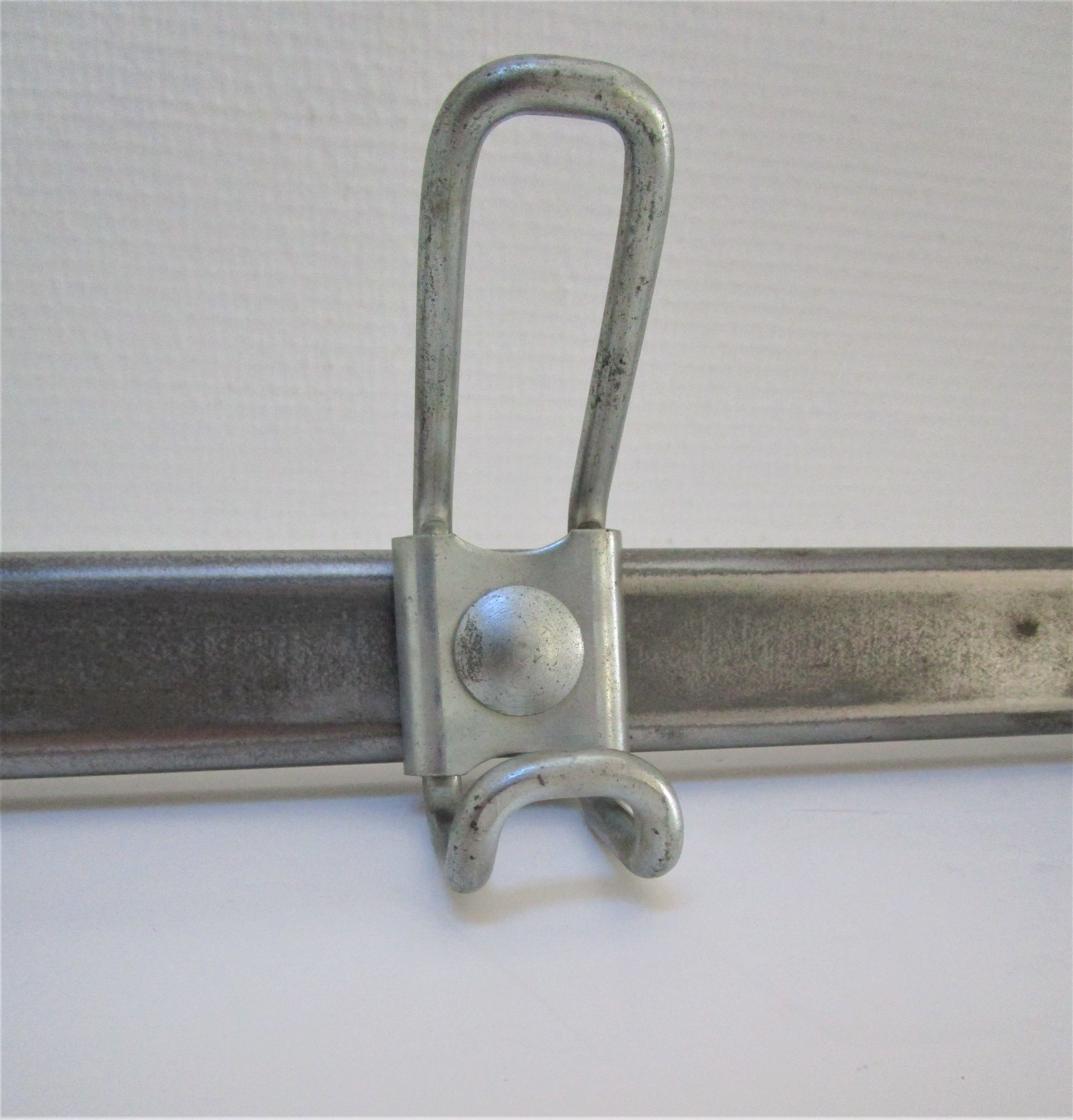 Vintage school wall rack in patinated steel
