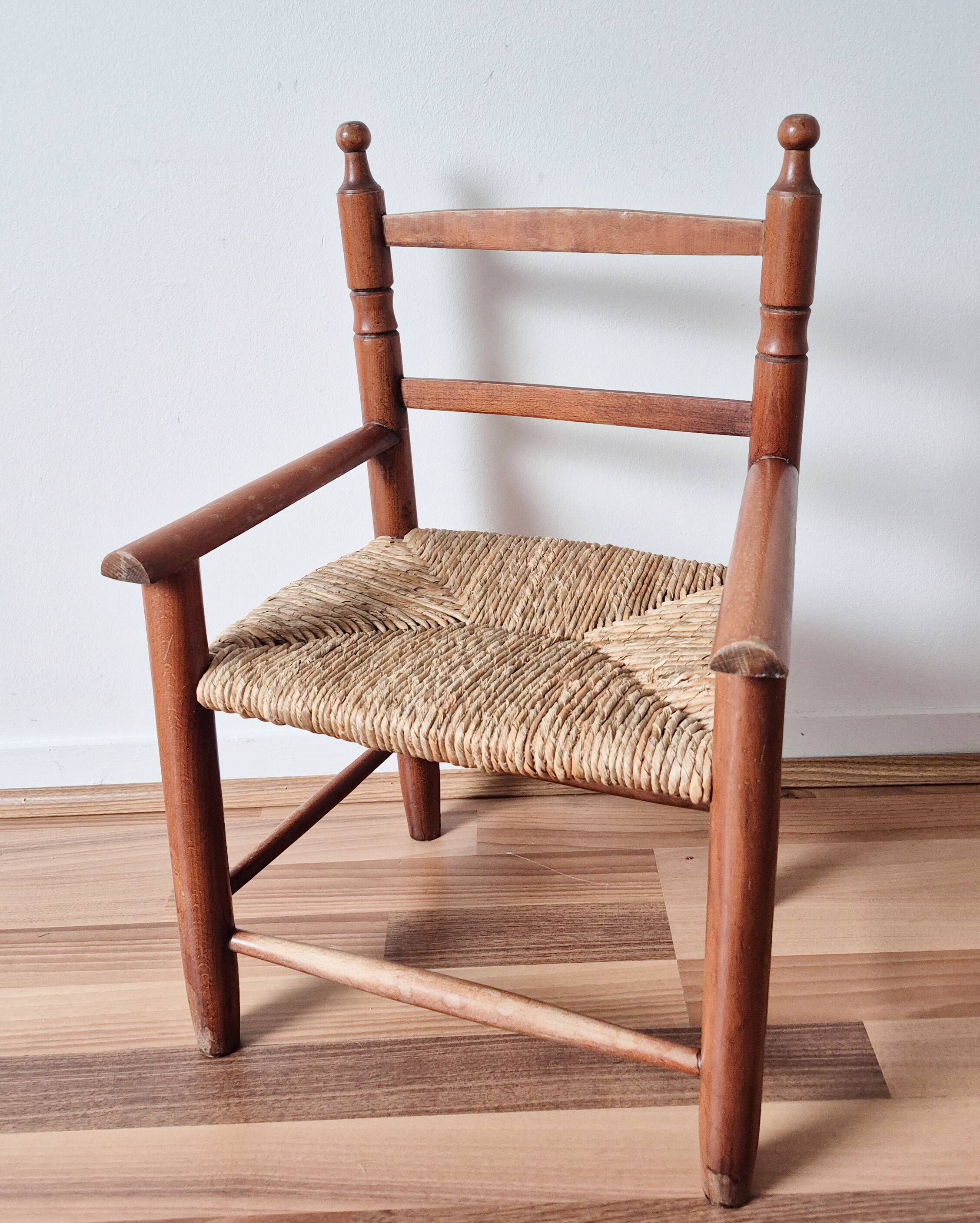 Vintage wooden and straw children's armchair