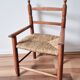 Vintage wooden and straw children's armchair