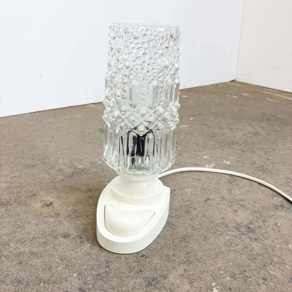 Table lamp by SAKU, glass bag on plastic base, 1970s